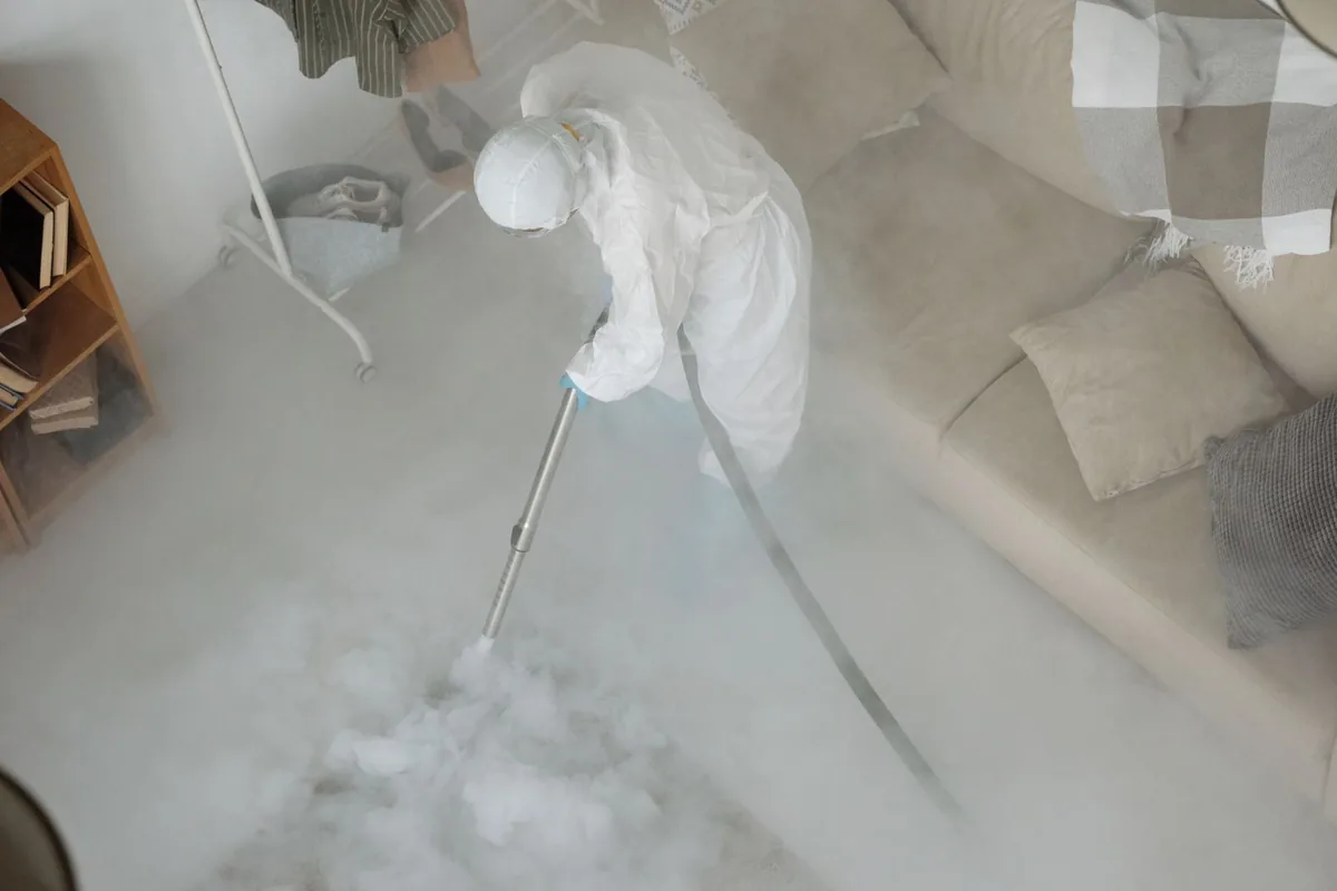 Biohazard cleanup technician in protective equipment, Pleasant Valley, MO